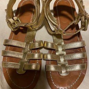 Coach gold grain leather flat Greek sandals size 9,5. Fits size 10